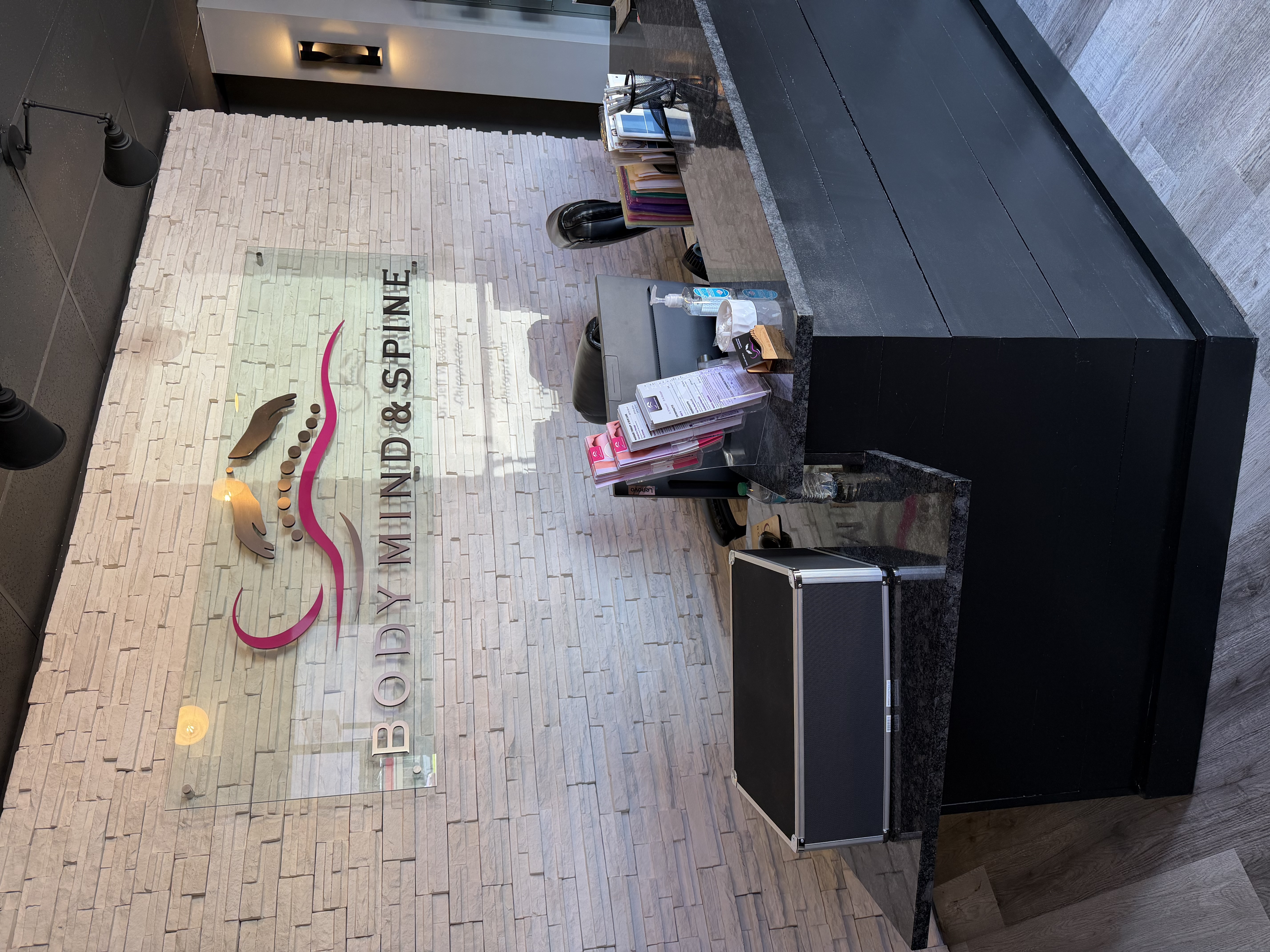 Reception area with the Body Mind & Spine sign in Mobile, AL