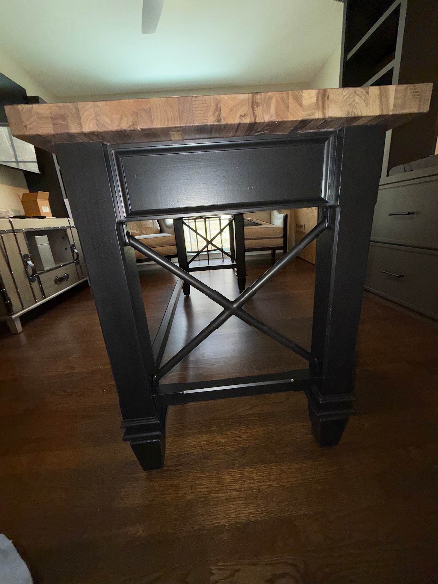 Wood butcher-block table on a blackened-steel base