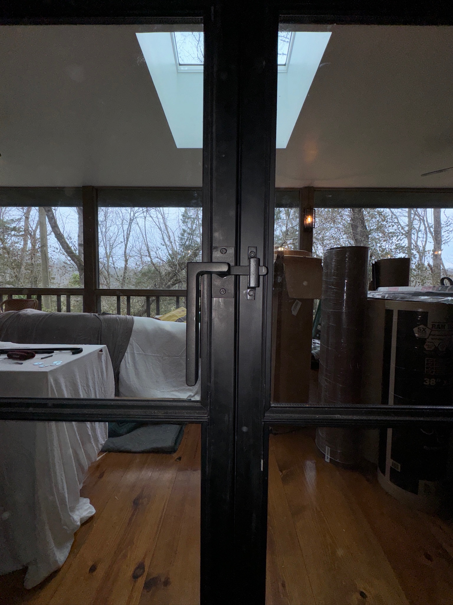 Black steel-framed glass entry doors