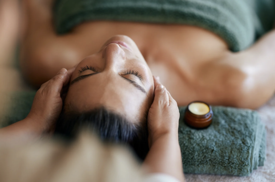 Craniosacral therapy — gentle hands cradling the temples during a calming session