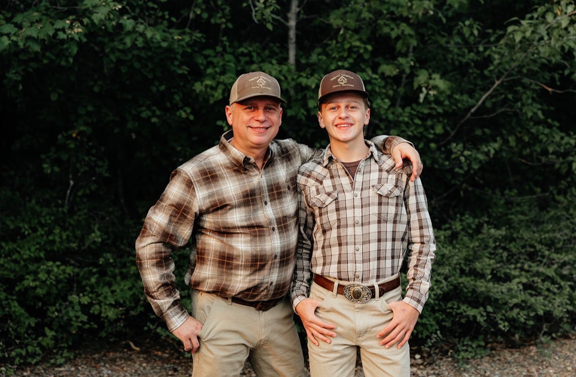 Owner Kenneth Ottino and his son in Helpful Neighbor Home Services caps and plaid shirts